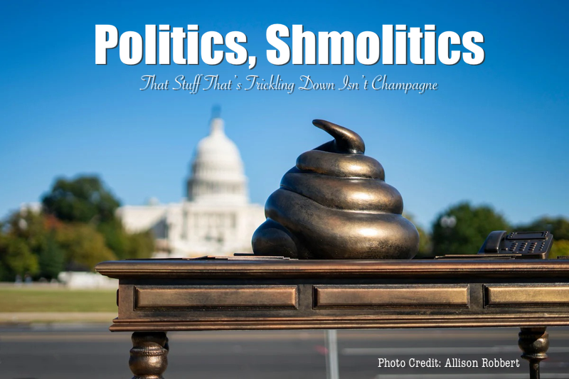 Bronze statue of Poop Emoji sitting on a bronze replica of Nancy Pelosi’s desk with capitol in background